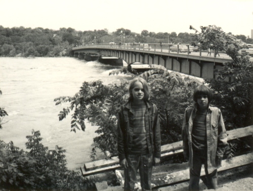 Kier and Nathan in front of the Potomac under Chain Bridge after Agnes flooding